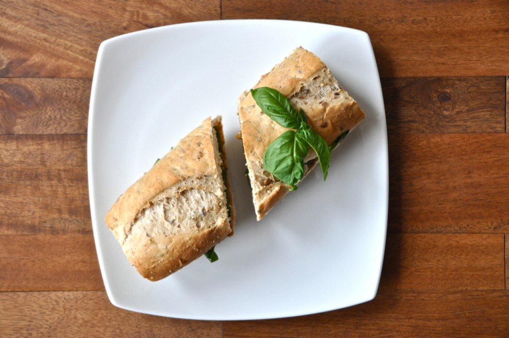 Halved Basil and Peanut Butter Sandwich on a plate