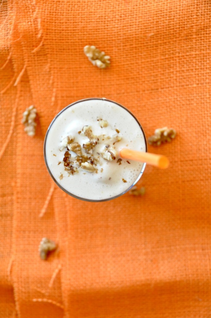 Top down shot of a Honey and Walnut Spiced Protein Shake with chopped walnuts on top