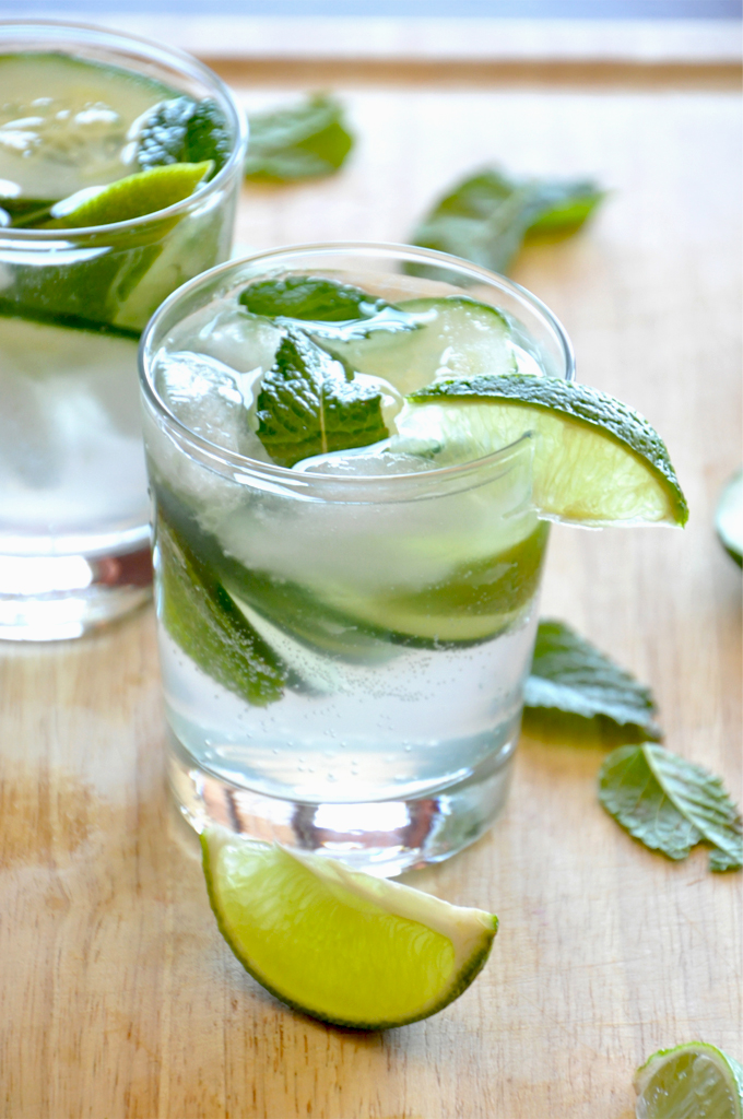 Cucumber Cooler Cocktails sitting on a cutting board ready for a festive summer evening
