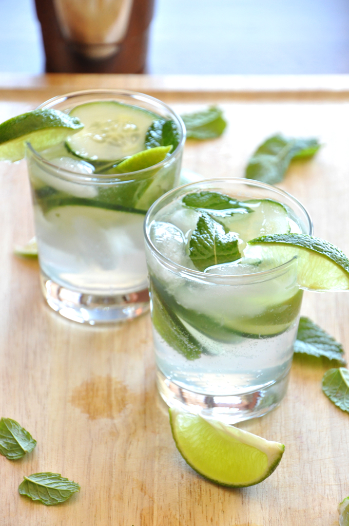 Two glasses of our Cucumber Cooler Cocktail recipe that tastes like sophisticated limeade