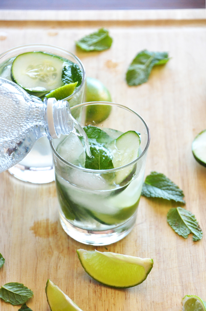 Filling up a glass for homemade Cucumber Cooler Cocktails