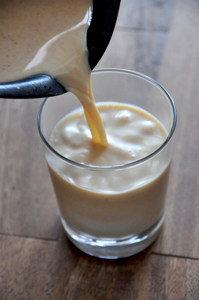 Pouring a glass of our delicious Boozy Pumpkin White Hot Chocolate