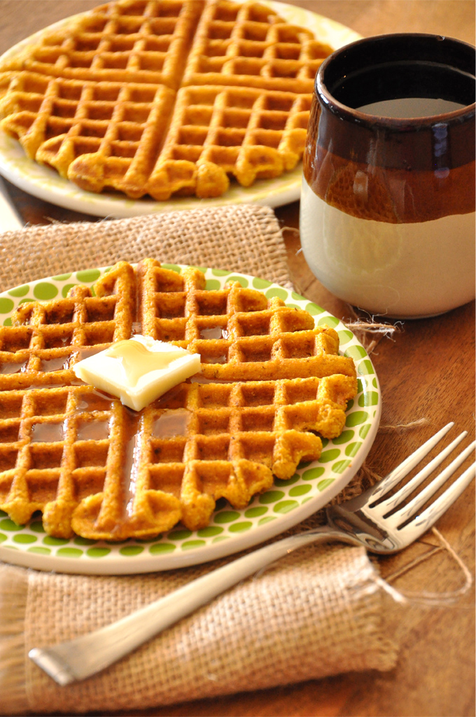Mug of coffee and plates of Vegan Pumpkin Cornbread Waffles