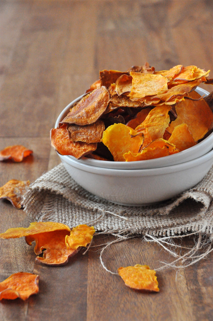 Bowl piled high with a batch of our Baked Sweet Potato Chips recipe