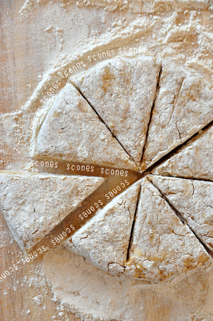 Cutting board with a batch of freshly cut scones ready to be baked
