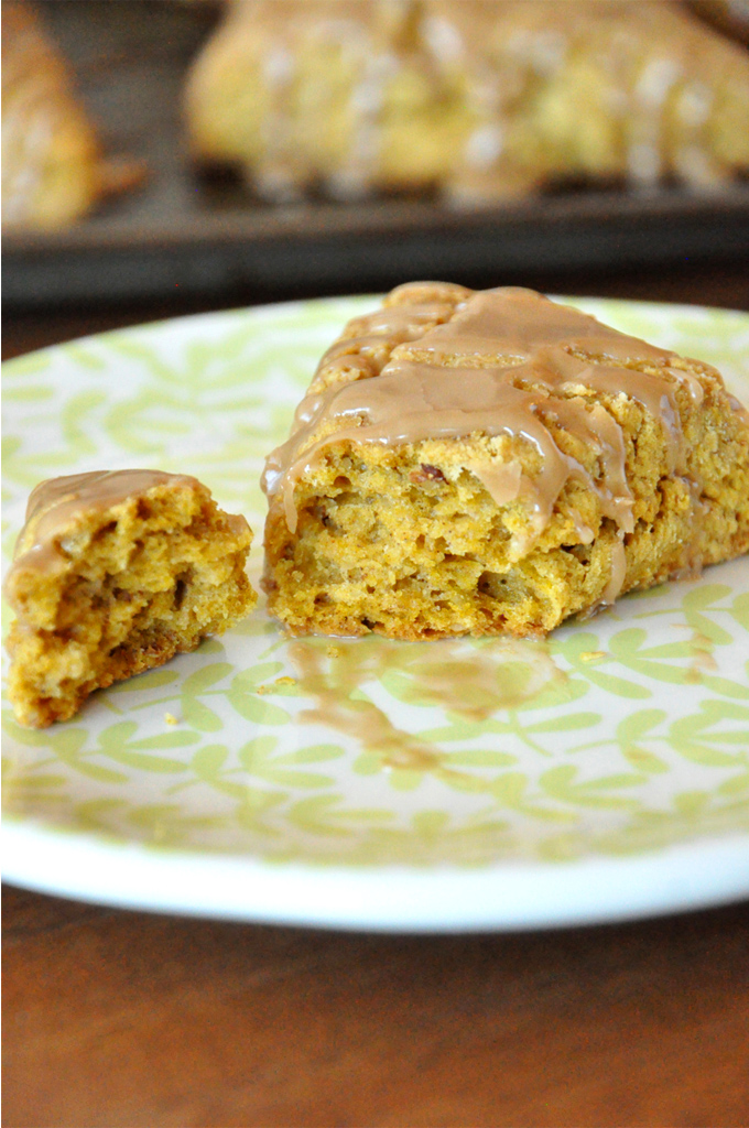 Revealing the flaky interior of one of our homemade Pumpkin Scones