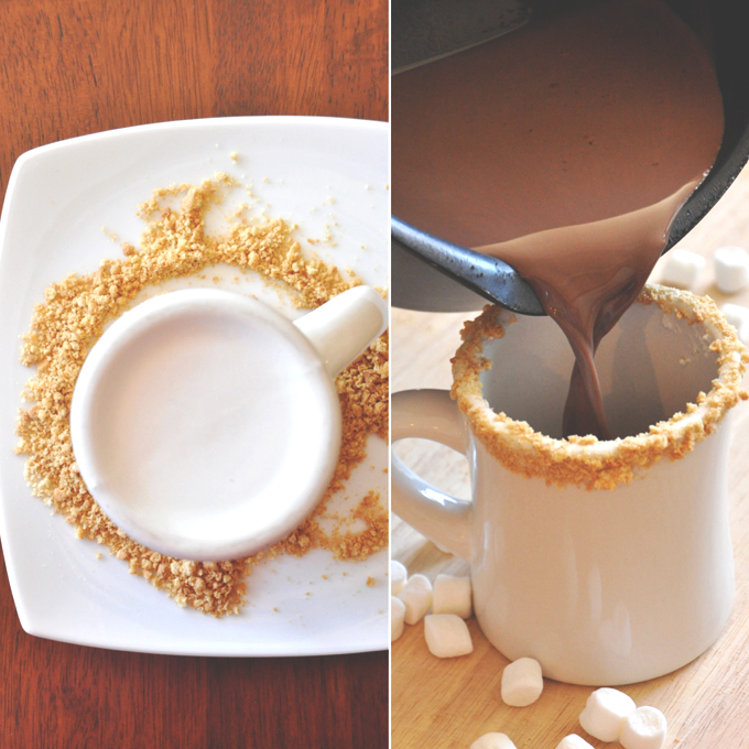 Pouring hot chocolate into a mug rim lined with graham cracker crumbs
