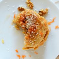Partially eaten stack of Vegan Carrot Coconut Pancakes