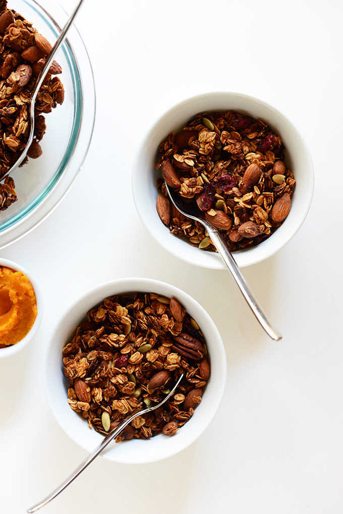 Bowls of the perfect fall granola made with cranberries and pepitas