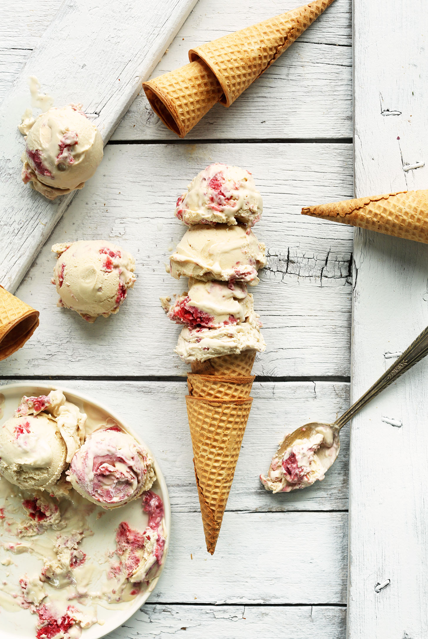 Sugar cone piled high with scoops of our delicious homemade vegan Raspberry Swirl ice cream
