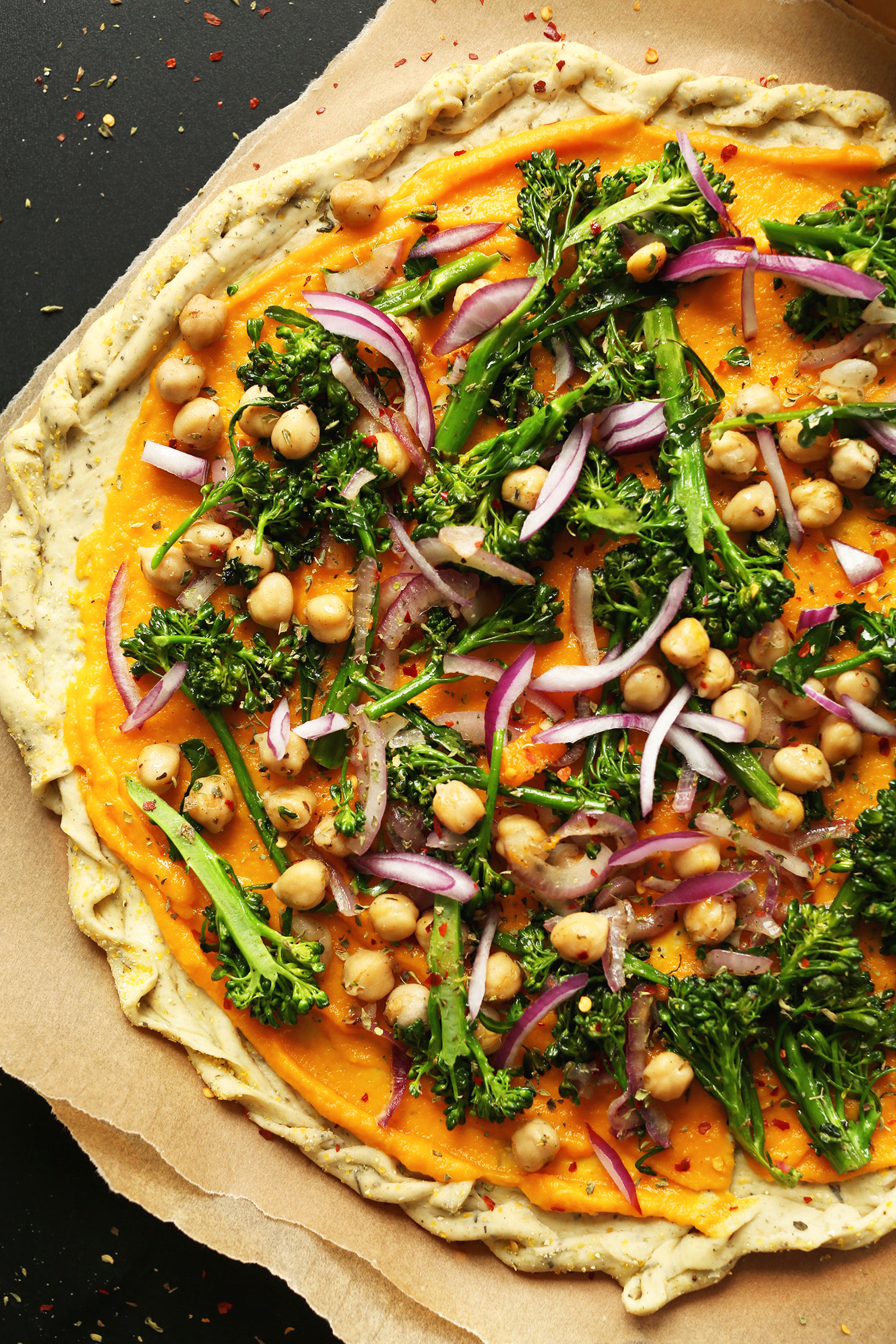 Homemade vegan pizza made with butternut squash sauce and lots of vegetables