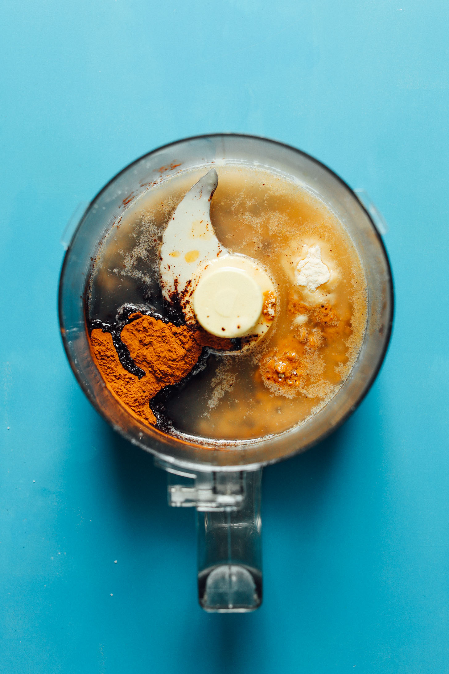 Ingredients in the food processor for making rich and satisfying Coconut Carob Bars 