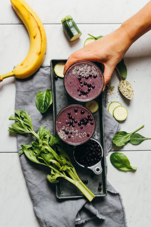 Picking up a Blueberry Zucchini Smoothie from a tray