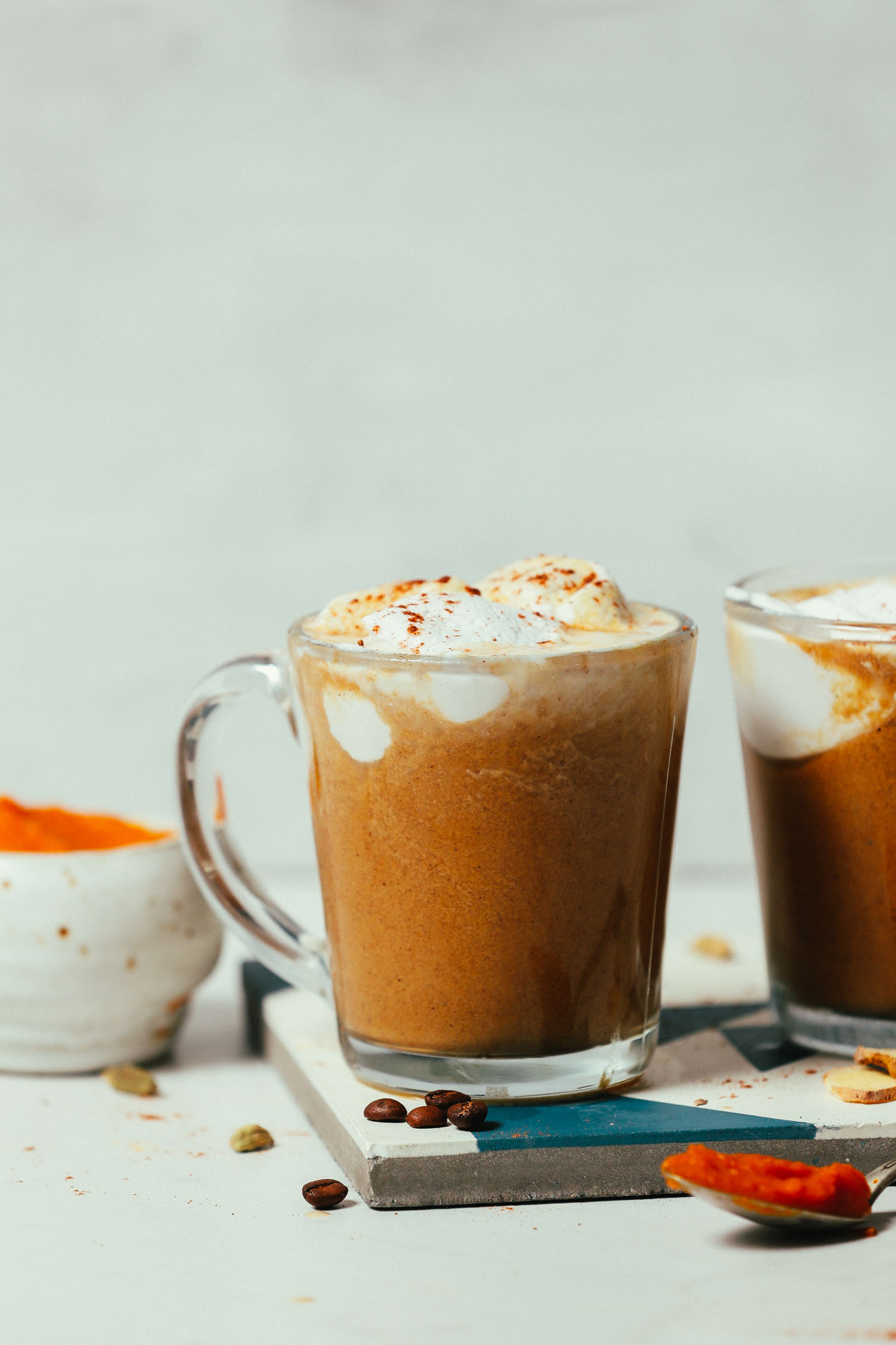 Side view of mugs of our healthy Pumpkin Spice Latte recipe 