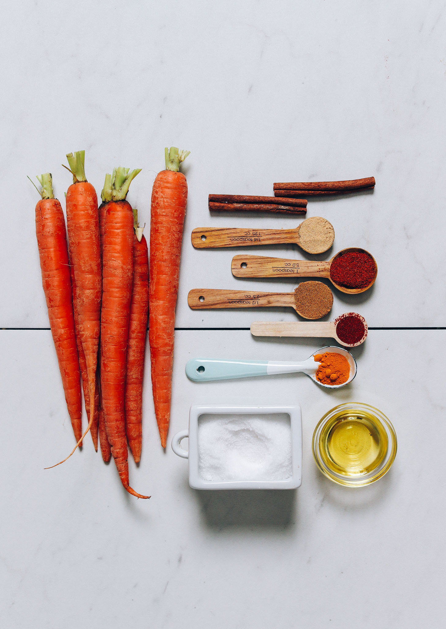 Carrots, cinnamon, ginger, smoked paprika, cumin, turmeric, salt, cayenne, and avocado oil for making our Roasted Carrots recipe
