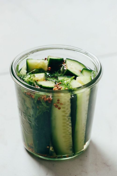 Jar of refrigerator pickles made with dill and spices