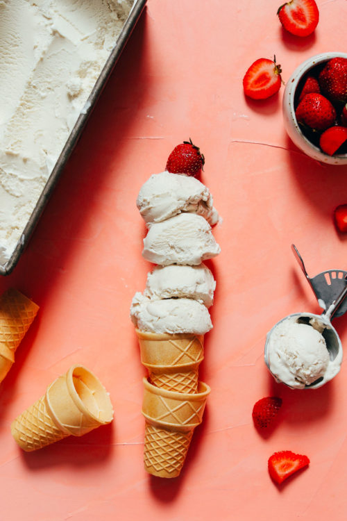 Scoops of vegan vanilla ice cream on sugar cones