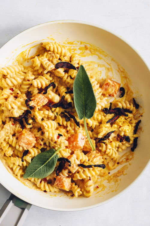 Bowl of Butternut Squash Pasta topped with sage leaves