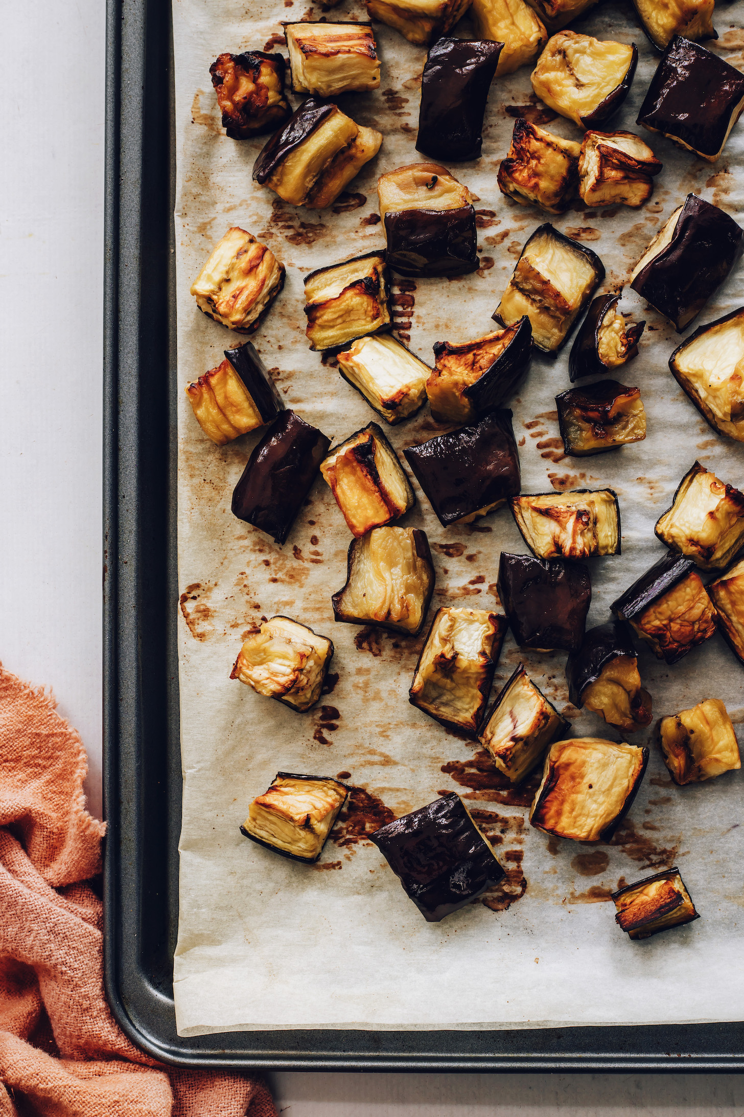Tender, caramelized roasted eggplant on a baking sheet