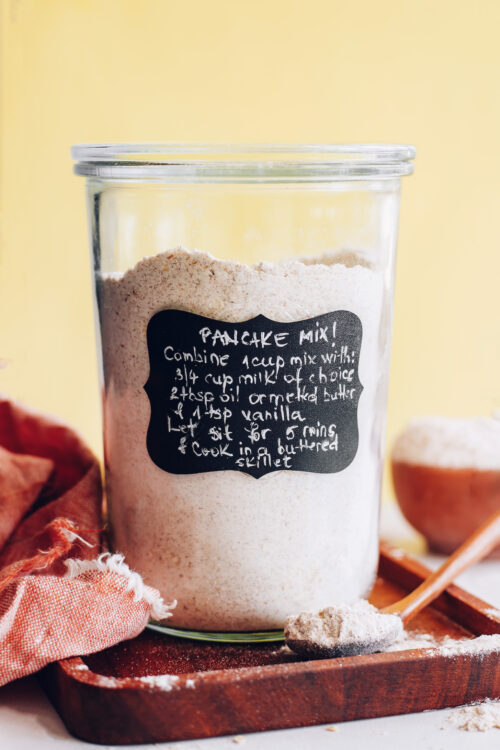 Jar and spoonful of whole grain vegan pancake mix
