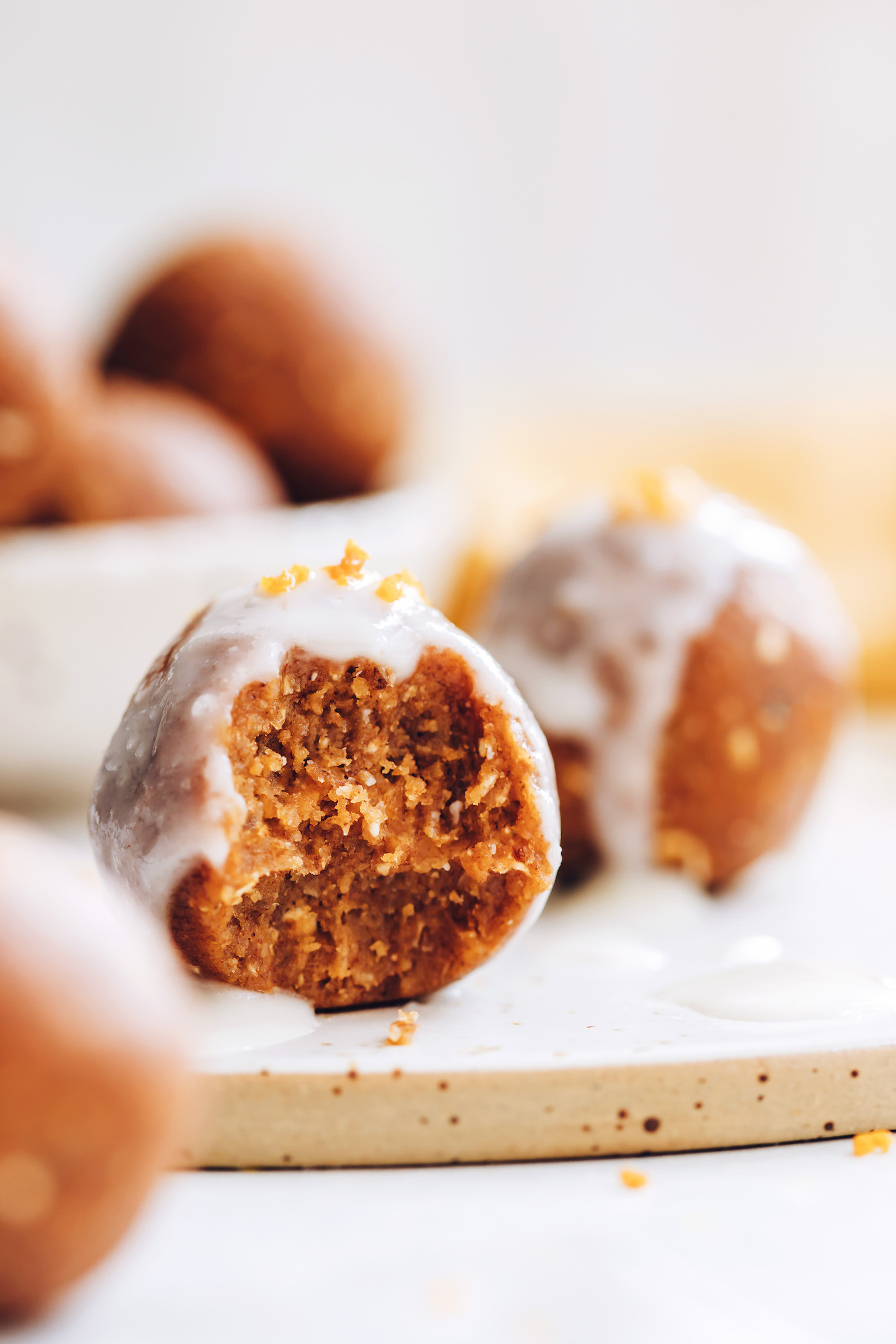 Showing the texture of a pumpkin spice cake bite with coconut butter glaze