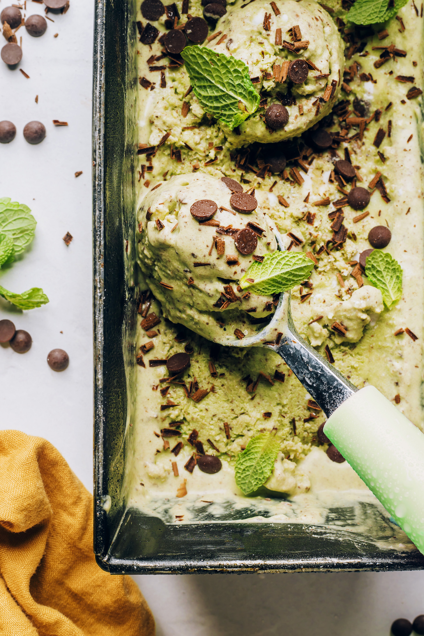 A close up on a scoop of mint chocolate ice cream 