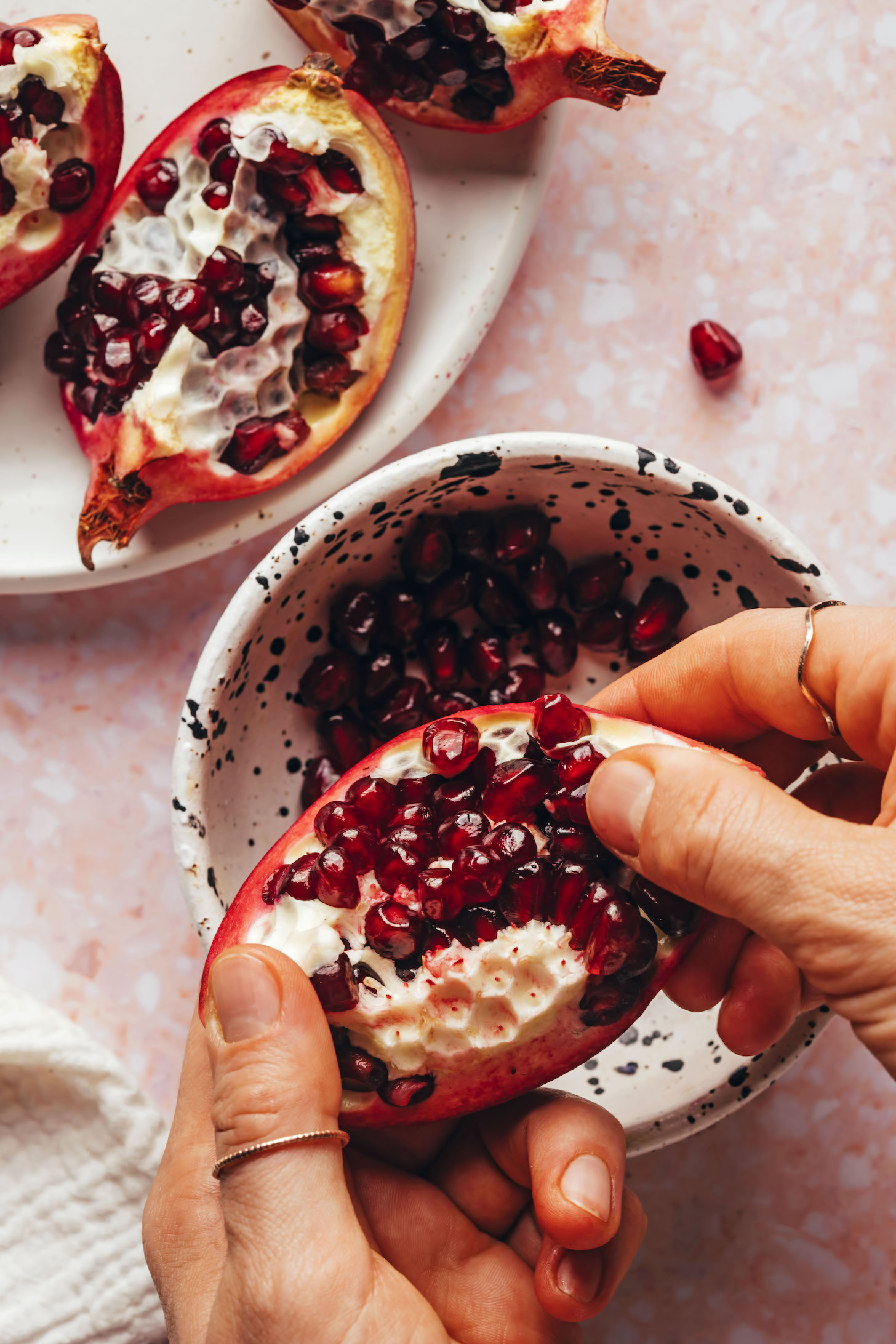 Showing how to seed a pomegranate