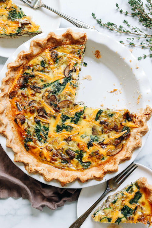 Slice and pie pan of our gluten-free vegan quiche recipe