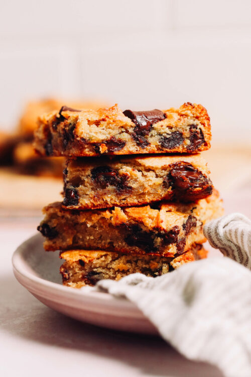 Stack of gluten-free sweet potato tahini blondies with chocolate chips